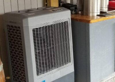 Portable air cooler next to tea dispensers