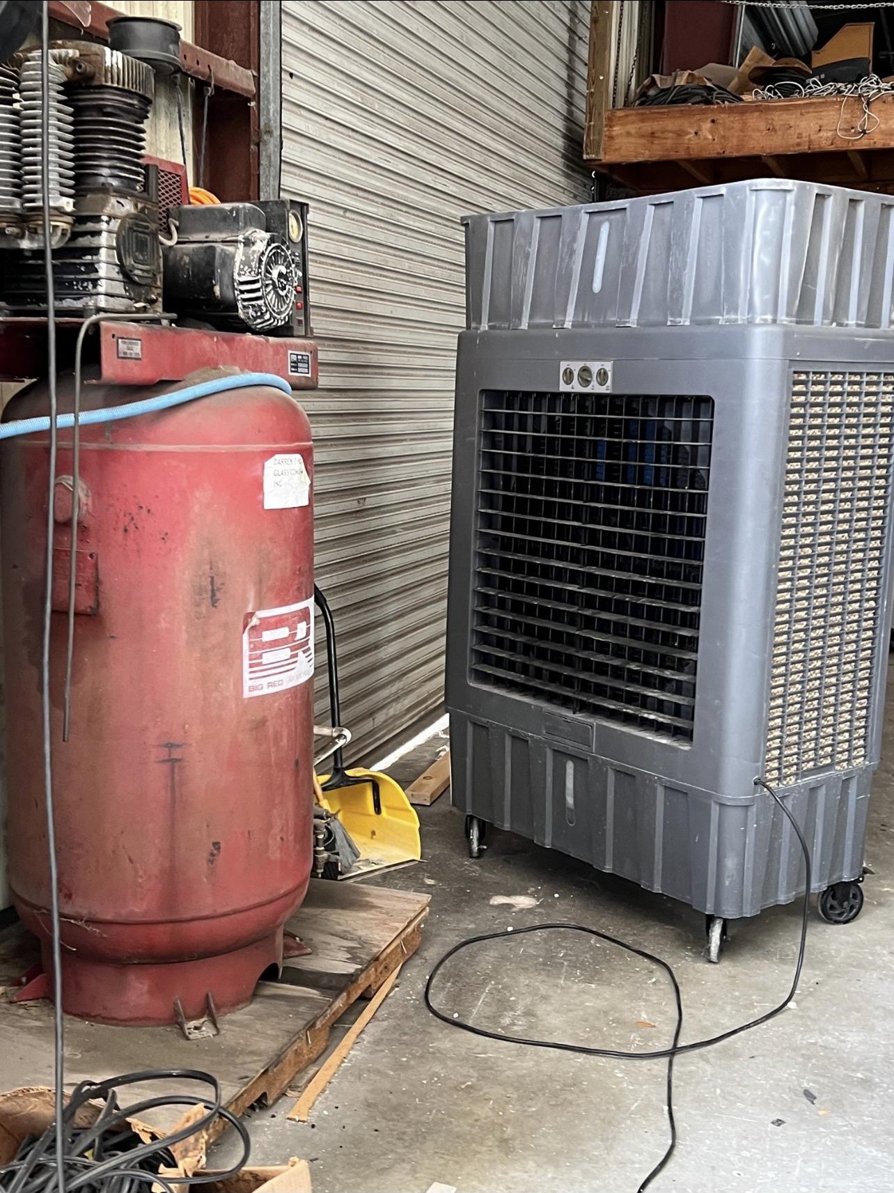 Industrial air compressor and evaporative cooler in warehouse
