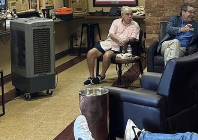 Men relaxing in a cigar lounge setting.