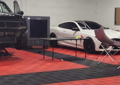 Car repair shop with white car on lift.