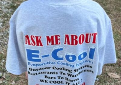 Child wearing 'Ask Me About E-Cool' t-shirt.