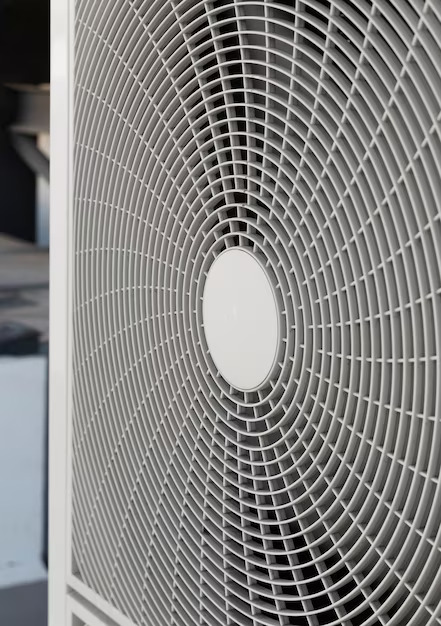 Close-up of a circular air conditioner vent.