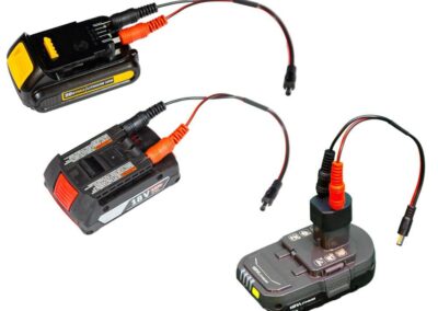 Three cordless power tool batteries with connectors