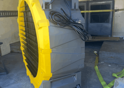 Large industrial fan with yellow casing in truck