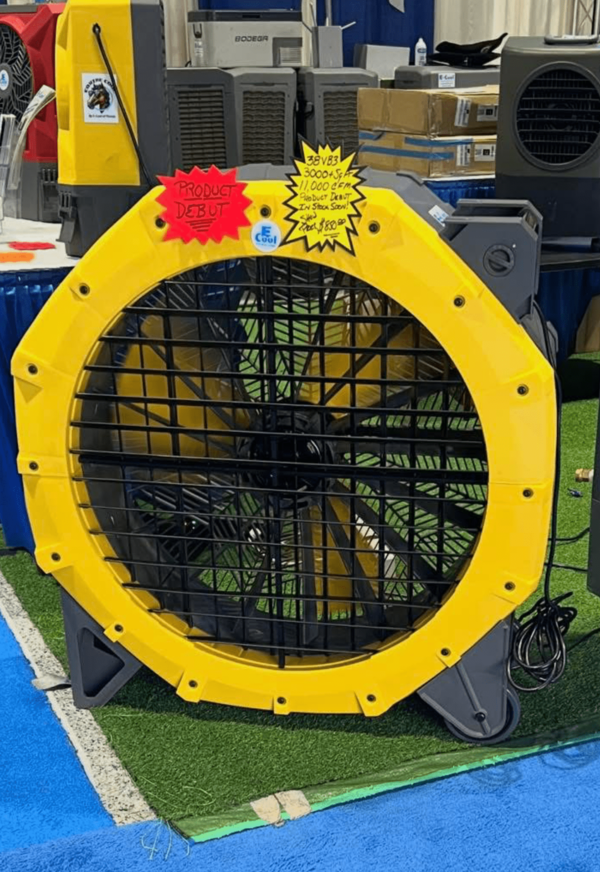 mvp 13000cfm floor fan model Large yellow industrial fan at exhibition display.